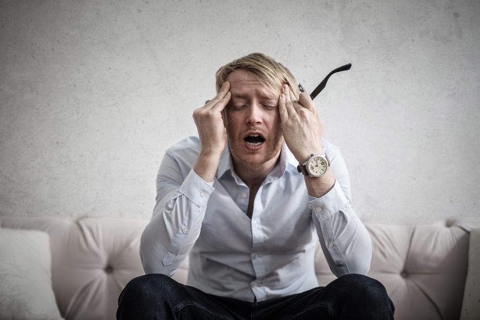 frustrated man watching tv buffering problem