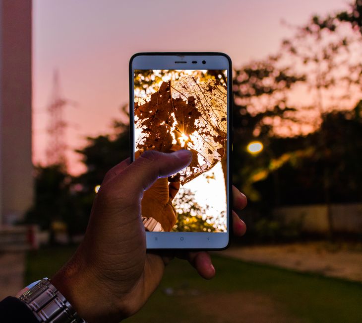 mobile phone watching tv outdoors
