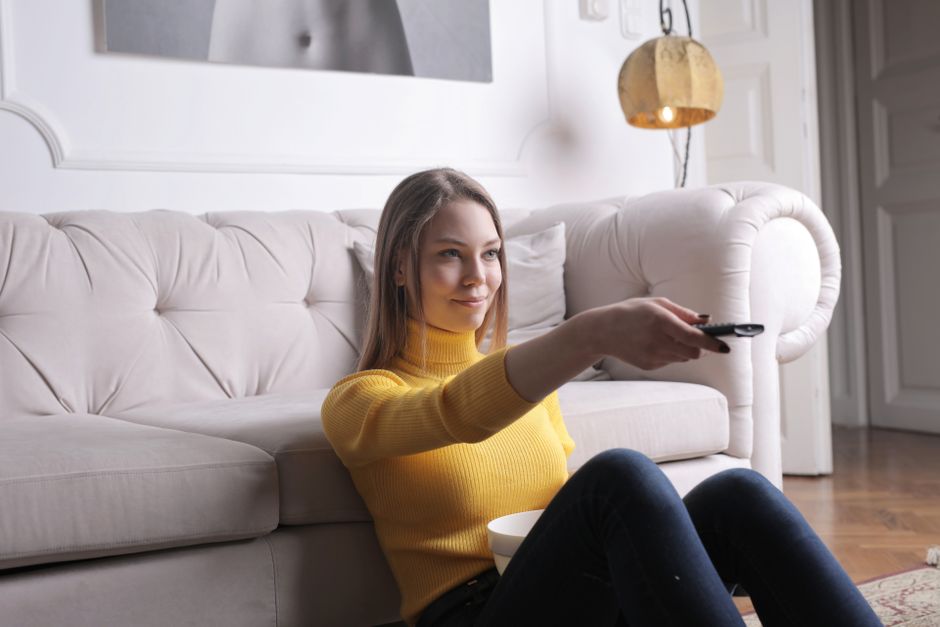 happy person watching tv home