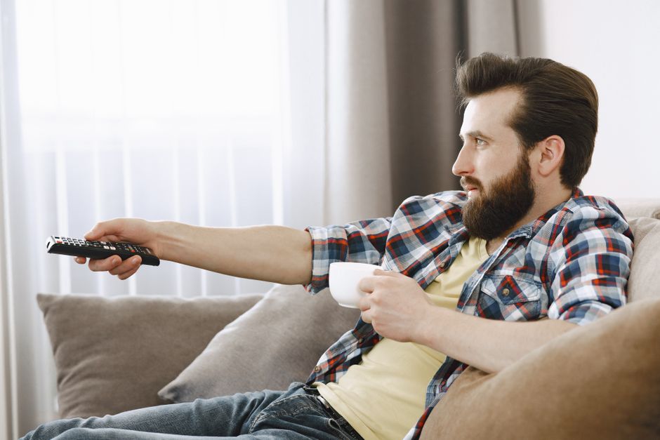 person watching TV satisfied living room